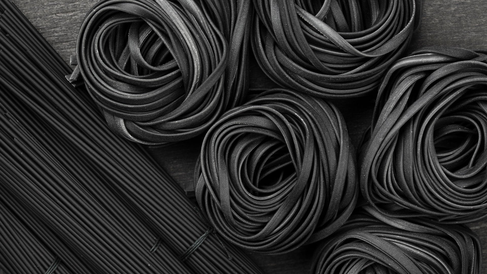 Close-up of black rubber on a wooden surface