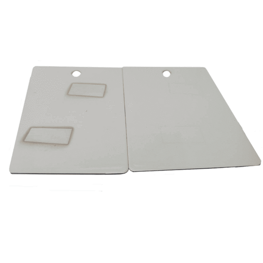 Two beige Staining ASTM D925 with cut-out handles on a white background