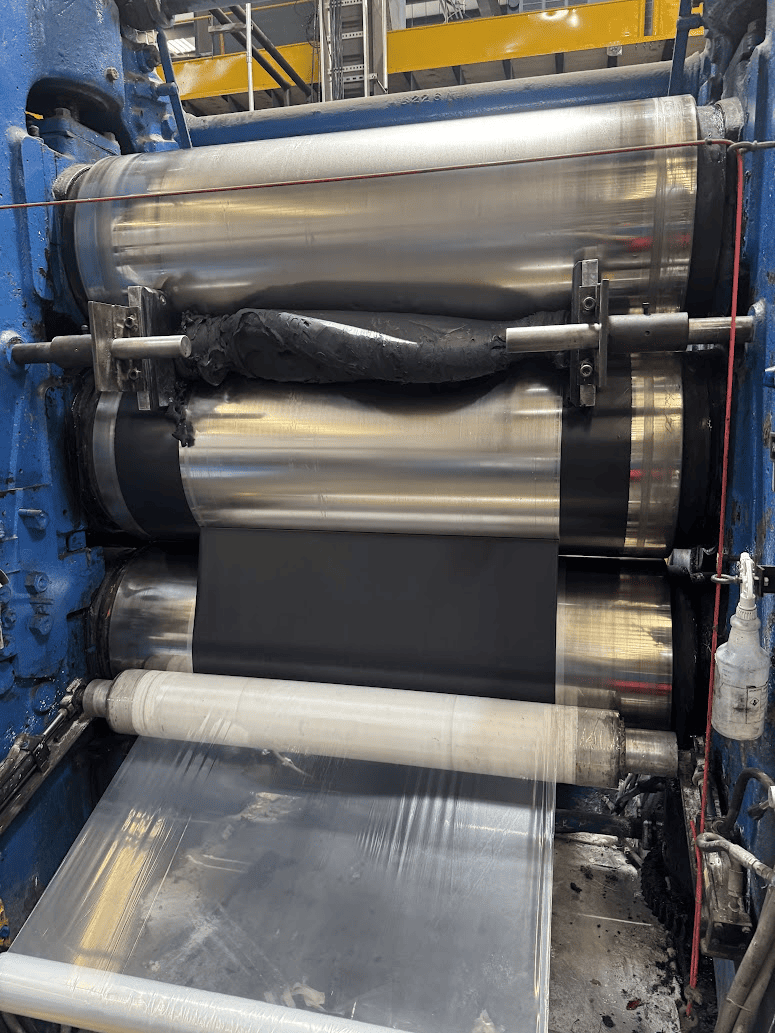 A calendering machine laminating rubber