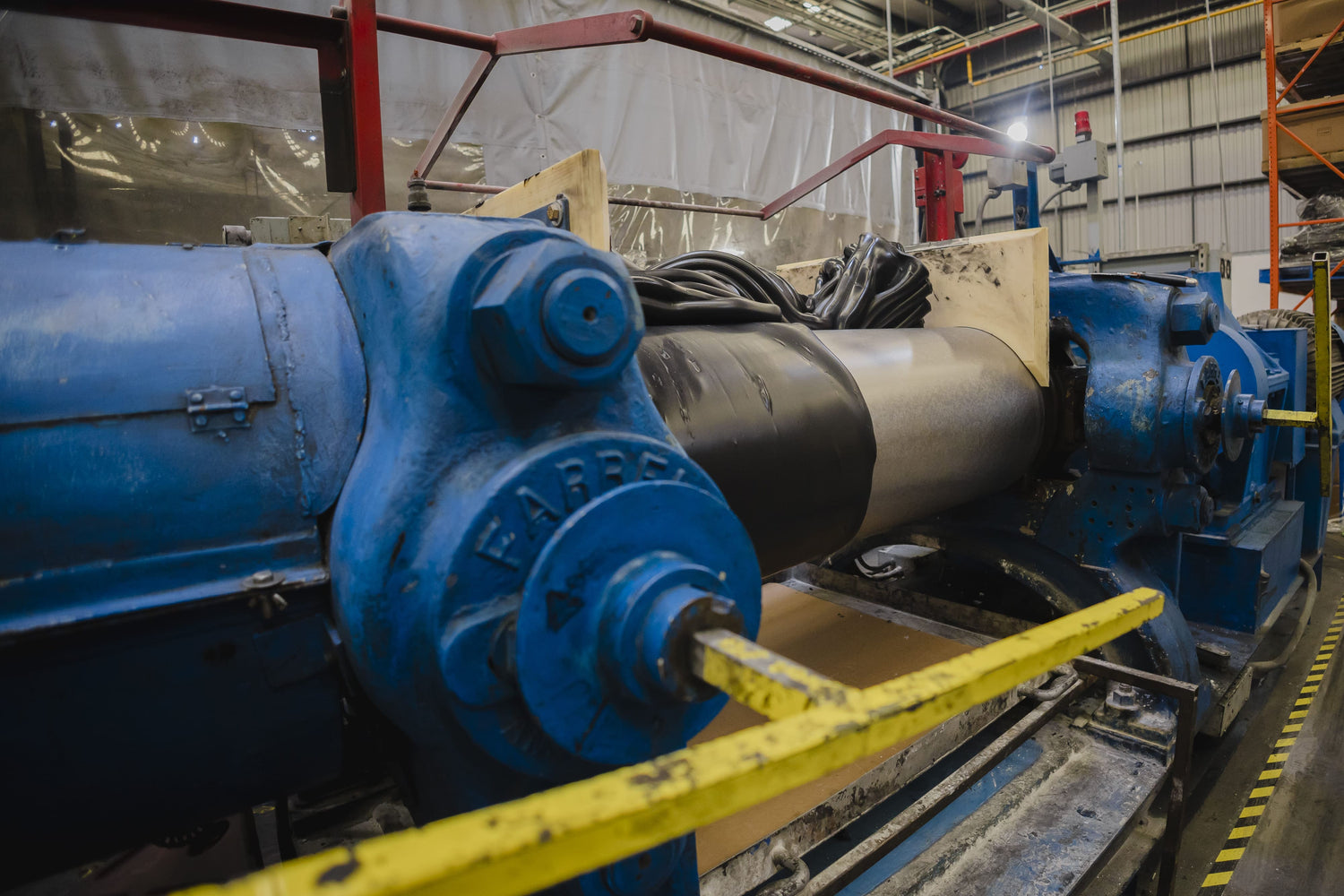 A steel mixer with rubber being processed
