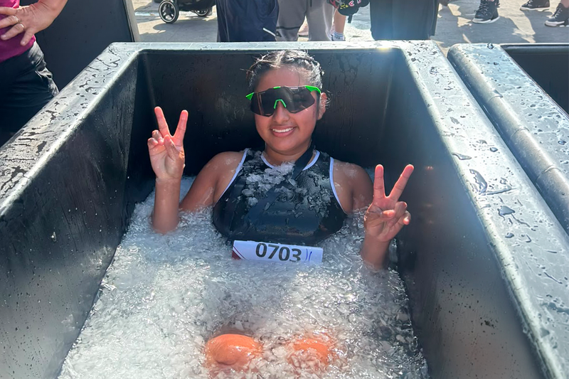 Woman smiling inside a ice tub